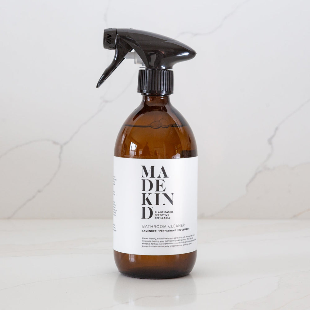 Photo of MadeKind Bathroom Cleaner in an amber glass bottle