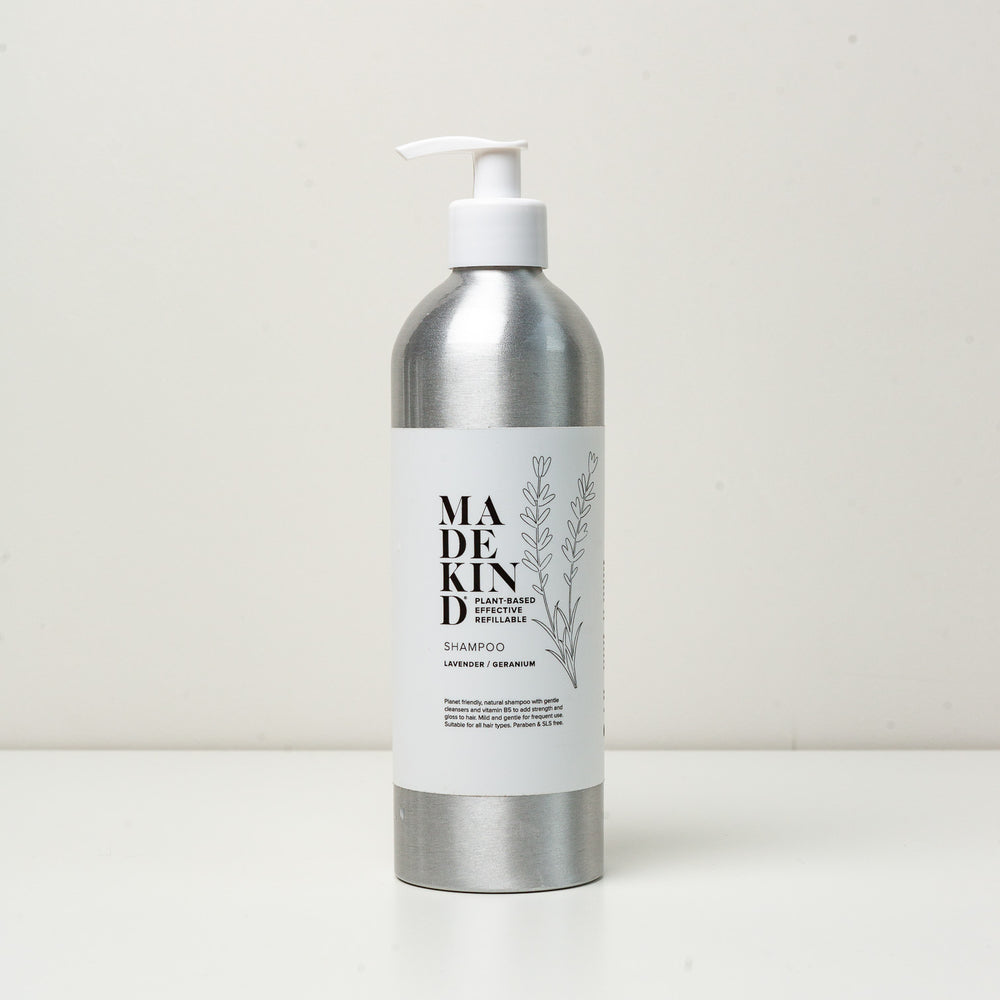 Photo of a 500ml aluminium bottle of MadeKind shampoo in Lavender & Geranium