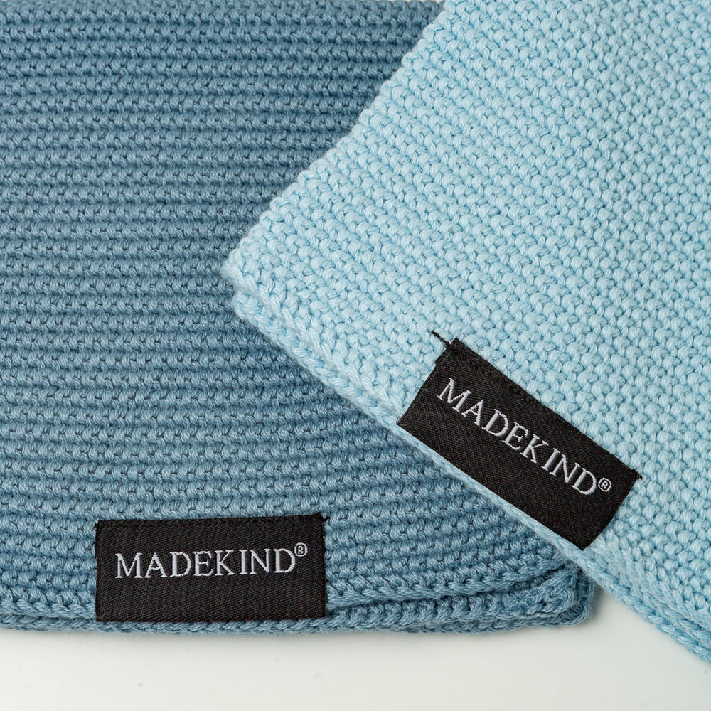 Photo of two blue madekind organic cotton dishcloths 