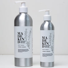 Load image into Gallery viewer, Photo of a large lavender and geranium bottle of body wash on the left of a smaller variant of the same product
