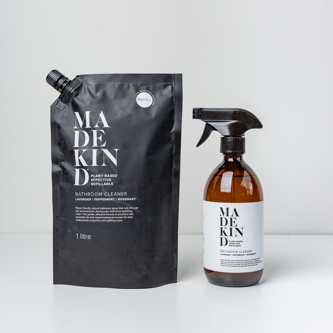 photo of a MadeKind natural bathroom cleaner in 500ml amber glass bottle with 1 litre bathroom cleaner refill pouch
