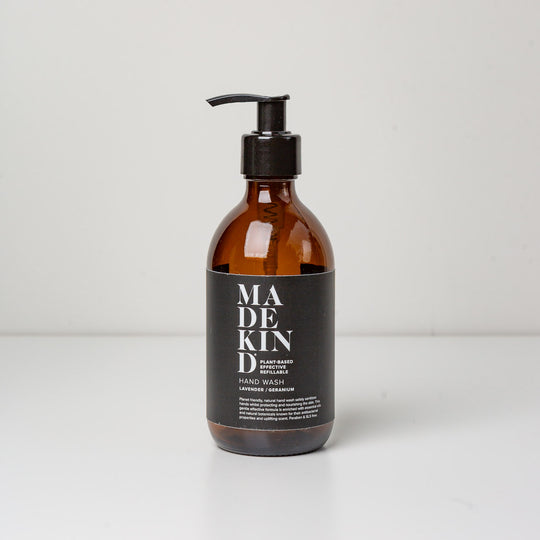 Photo of empty 300ml amber glass bottle with pump for lavender and geranium hand wash or hand lotion