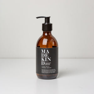 Photo of empty 300ml amber glass bottle with pump for lavender and geranium hand wash or hand lotion