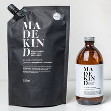 Load image into Gallery viewer, photo of MadeKind natural floor cleaner in an amber glass bottle with a 1 litre refill pouch
