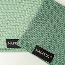 Load image into Gallery viewer, Photo of two green madekind organic cotton dishcloths 
