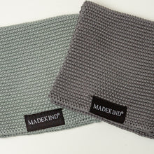 Load image into Gallery viewer, Photo of two grey madekind organic cotton dishcloths 

