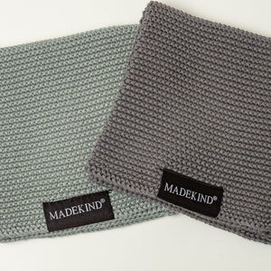Photo of two grey madekind organic cotton dishcloths 