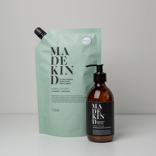 Photo of a MadeKind 1 Litre Hand Lotion Refill pouch and an empty glass bottle