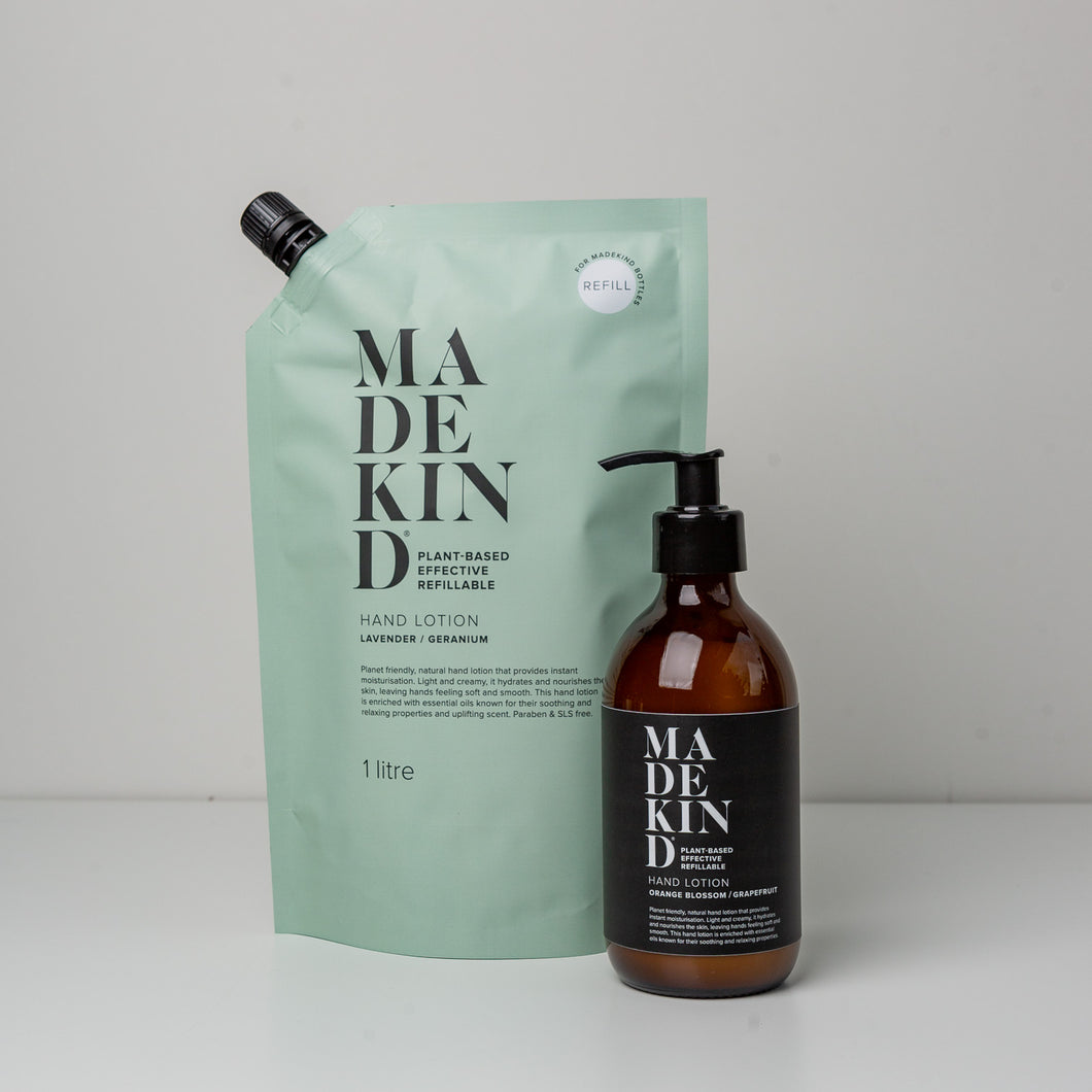 Photo of a MadeKind 1 Litre Hand Lotion Refill pouch and an empty glass bottle