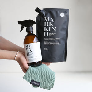 Photo of hands holding the MadeKind multi surface Cleaner Starter Set