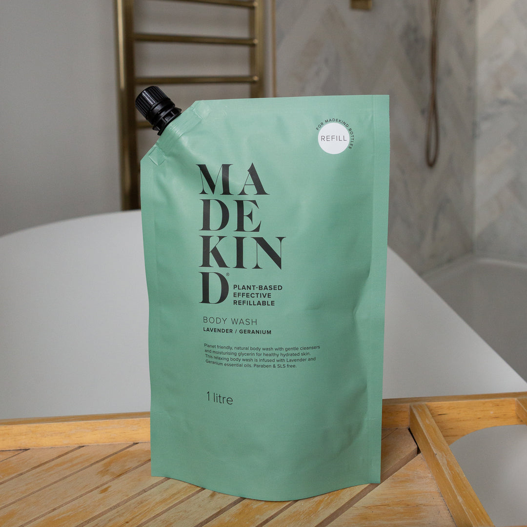 MadeKind Body Wash Refill Pouch on a bath tidy across a bath