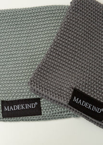 Photo of two grey madekind organic cotton  dishcloths 