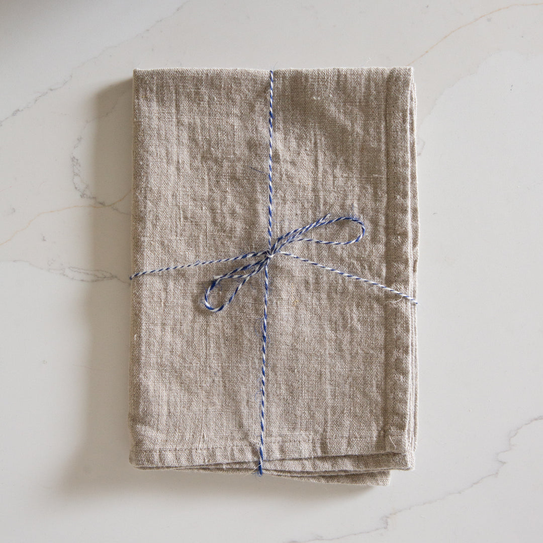 Photo of a Woven Linen Natural Tea Towel on a kitchen island