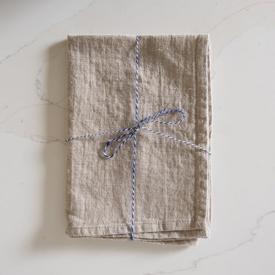 Photo of a Woven Linen Natural Tea Towel on a kitchen island