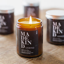Load image into Gallery viewer, Madekind Unwind Soy wax aromatherapy candle with essential oils in glass container
