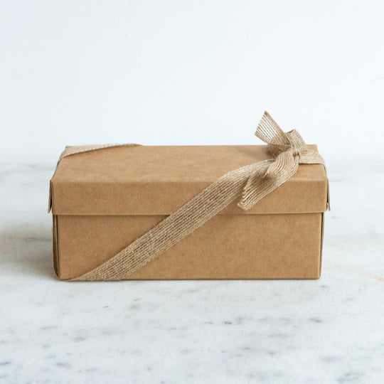 Photo of a box with a ribbon around it