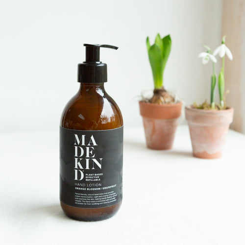 Photo of MadeKind Natural hand lotion with orange blossom and grapefruit essential oils in a 300ml amber glass bottle