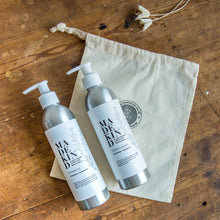 Load image into Gallery viewer, Natural and nourishing hair shampoo and conditioner in refillable aluminium bottles. The best natural shampoo for curly hair. Moisturises and conditions leaving hair cleansed and shiny. Natural, biodegradable ingredients mean it&#39;s kind to the environment and to you. The perfect gift as comes with a free cotton drawstring bag.  Edit alt text
