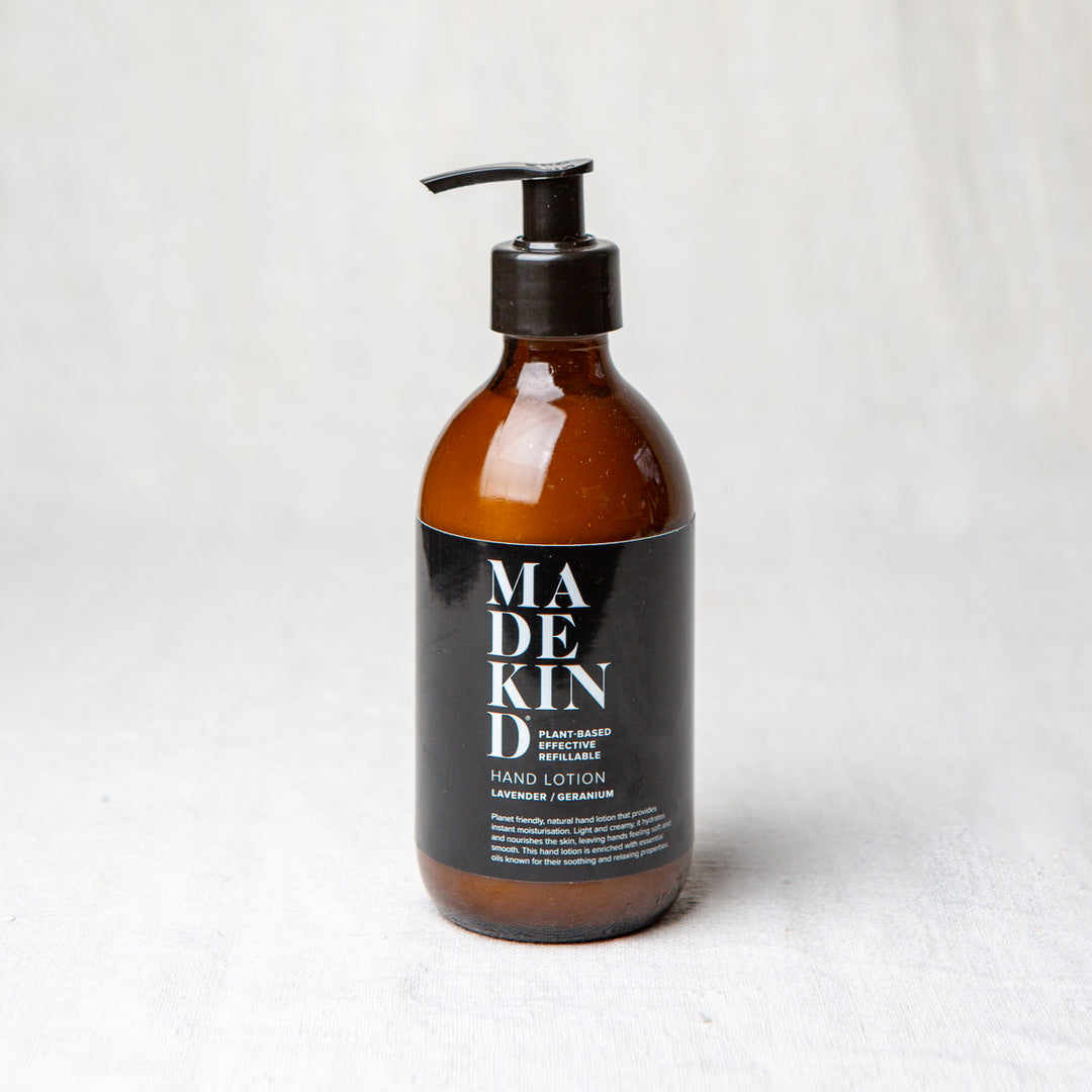 Natural hand lotion in amber glass bottle with lavender and geranium essential oils