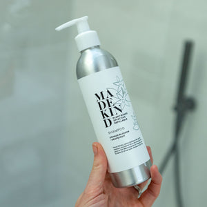 natural shampoo in an aluminium refillable bottle with orange blossom and geranium essential oils